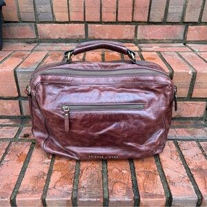 Etienne Aigner brown leather handbag, a brand recognized for leather goods